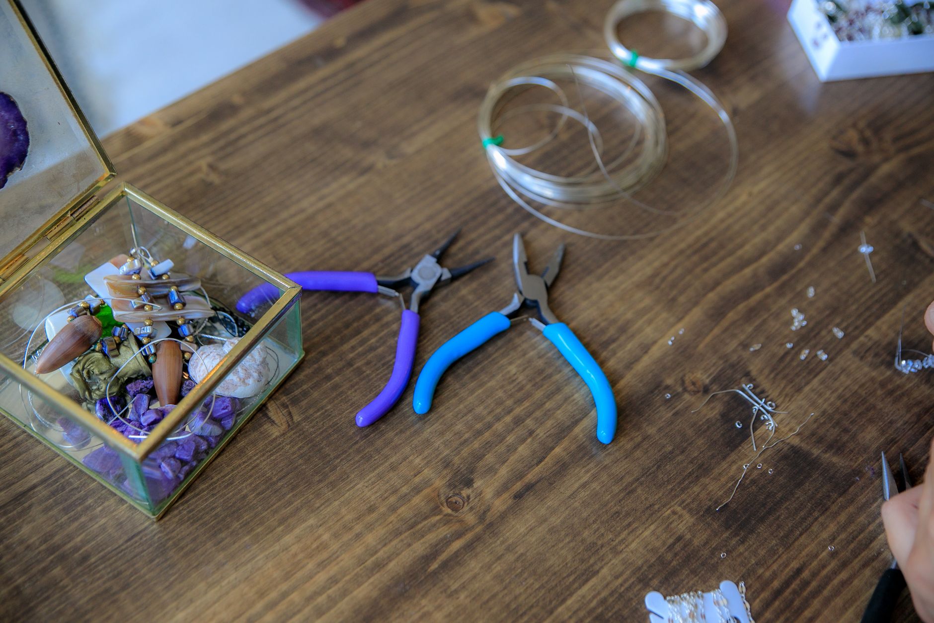 Wire loops and jewelry-making tools on a table